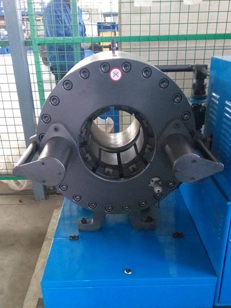 A blue large caliber hose crimping machine (type F).