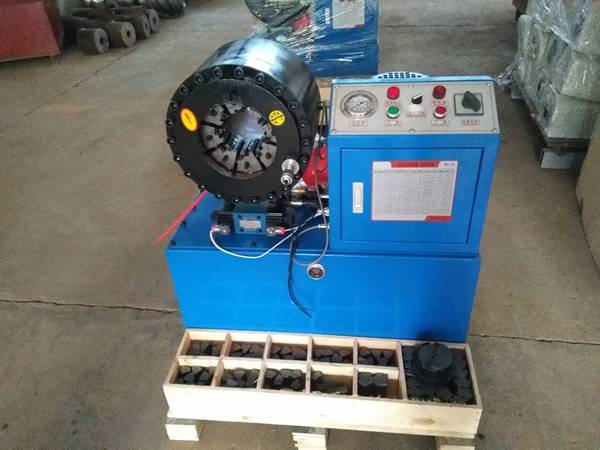 A set of vertical high pressure hydraulic hose crimping machine on the ground.